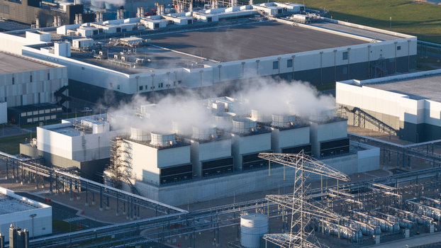 Drone view of a hyperscale data center in Eemshaven showing cloud computing server infrastructure cooling systems backup power and digital connectivity. Drone view of a hyperscale data center in Eemshaven showing cloud computing server infrastructure cooling systems backup power and digital connectivity.