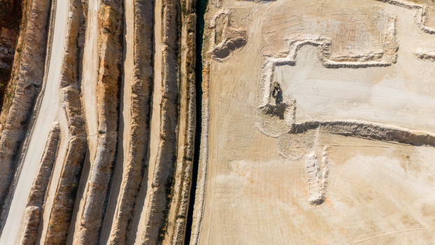 Aerial view of the open pit mine showing terraced excavation patterns and industrial earthworks in Besenovo Vojvodina Serbia. Aerial view of the open pit mine showing terraced excavation patterns and industrial earthworks in Besenovo Vojvodina Serbia.