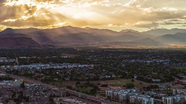 Aerial view of Arvada at sunset with mountain backdrop United States.