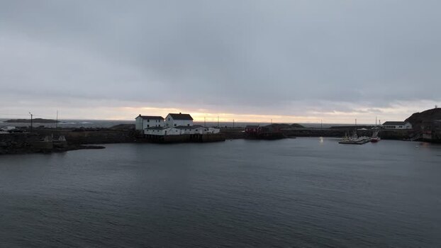 Aerial view of Lofoten coastal harbour at sunset Norway.