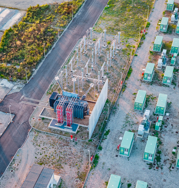 Aerial view of a high voltage substation and battery storage units at an industrial energy facility showing transformers switchgear and modern electrical infrastructure in Italy. Aerial view of a high voltage substation and battery storage units at an industrial energy facility showing transformers switchgear and modern electrical infrastructure in Italy.