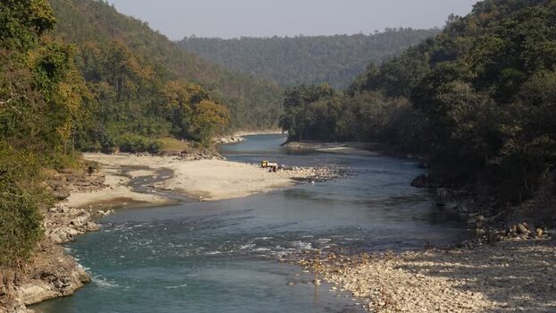 View of a winding river in a lush valley Nepal.
