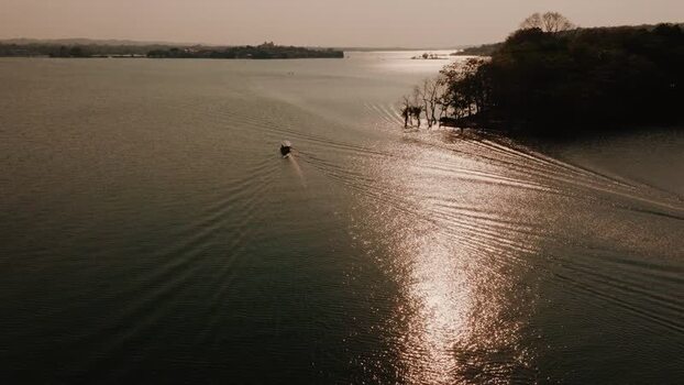 Aerial view of a boat on Lake Peten Itza near Flores Guatemala.