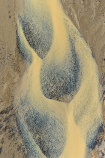 Aerial view of the intricate braided river channels of Drangajokull with sediment rich glacial water flowing through the rugged terrain of Isafjordur Isafjardarbaer Iceland. Aerial view of the intricate braided river channels of Drangajokull with sediment rich glacial water flowing through the rugged terrain of Isafjordur Isafjardarbaer Iceland.