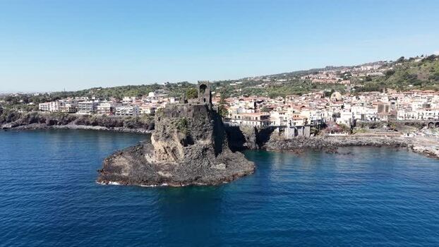 Aerial view of Castello Normanno on a volcanic rock in Italy. Aerial view of Castello Normanno on a volcanic rock in Italy.