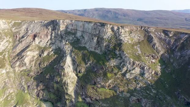 Aerial view of Tormore Island sea stack in Ireland.