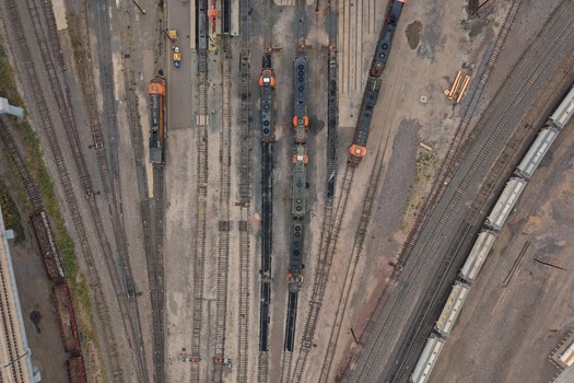 Aerial view of a train yard with multiple locomotives parked on parallel tracks in Denver Colorado United States. Aerial view of a train yard with multiple locomotives parked on parallel tracks in Denver Colorado United States.