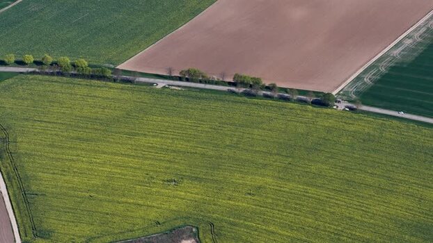 Aerial view of cultivated fields and road France.