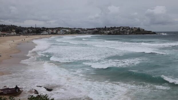 View of Bondi Beach with rolling waves in Sydney Australia.