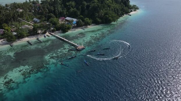 Aerial view of boats near Raja Ampat pier in Indonesia. Aerial view of boats near Raja Ampat pier in Indonesia.