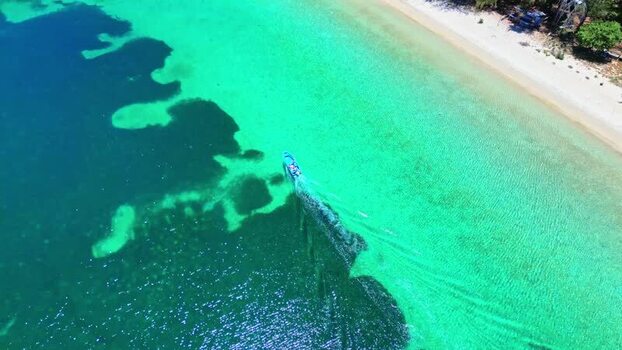 Aerial view of a boat in turquoise waters of Guanaja Honduras. Aerial view of a boat in turquoise waters of Guanaja Honduras.
