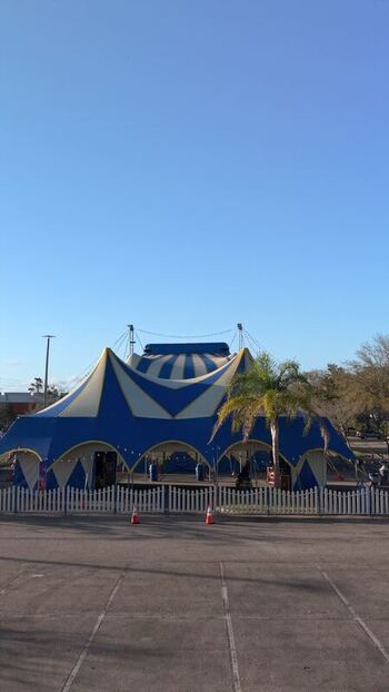 Aerial view of a big blue and white tent United States. Aerial view of a big blue and white tent United States.