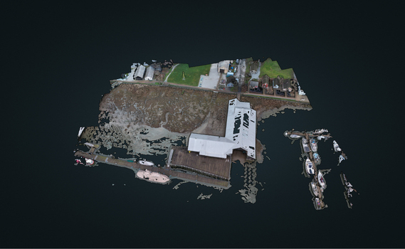 Aerial view of a 3D photogrammetry model of a waterfront area with a dock boats and buildings in Richmond British Columbia Canada. Aerial view of a 3D photogrammetry model of a waterfront area with a dock boats and buildings in Richmond British Columbia Canada.