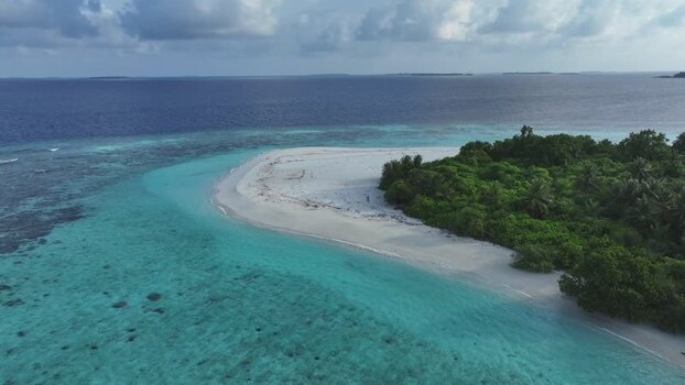 Aerial view of a tropical island with white sand and turquoise water Maldives. Aerial view of a tropical island with white sand and turquoise water Maldives.