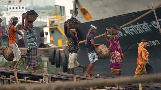 View of workers carrying coal baskets at Aminbazar Bangladesh. View of workers carrying coal baskets at Aminbazar Bangladesh.