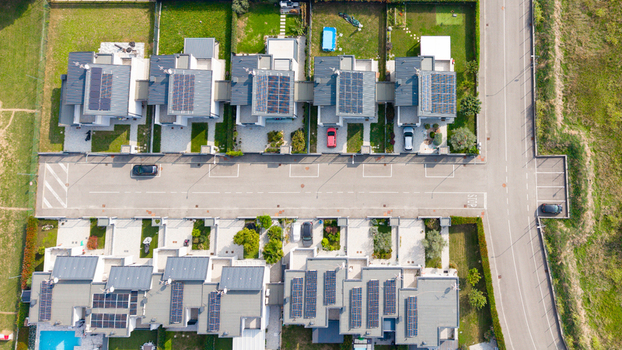 Aerial view of modern residential houses featuring private gardens swimming pools and rooftop solar panels in Milan Lombardy Italy. Aerial view of modern residential houses featuring private gardens swimming pools and rooftop solar panels in Milan Lombardy Italy.