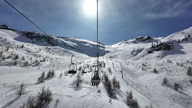 View of ski lifts and snowy slopes in Sestriere Italy. View of ski lifts and snowy slopes in Sestriere Italy.