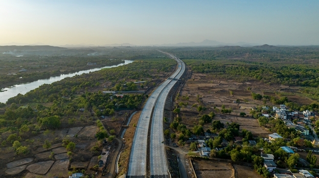 Aerial view of the JNPT highway winding through the rural landscape of Badlapur Maharashtra India. Aerial view of the JNPT highway winding through the rural landscape of Badlapur Maharashtra India.