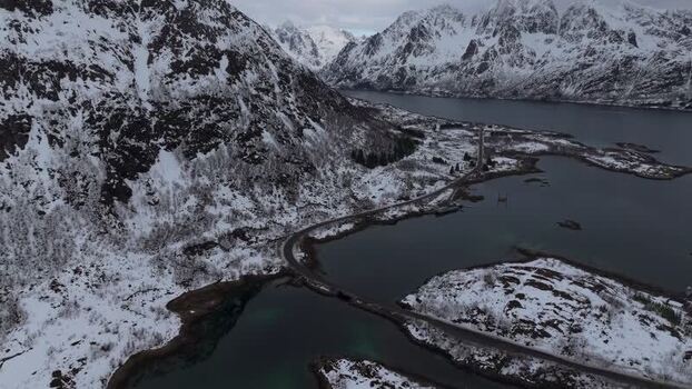 Aerial view of Lofoten mountains and coastal road Norway.