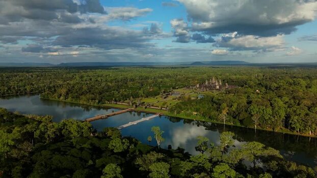 Aerial view of Angkor Wat temple complex surrounded by forest Cambodia. Aerial view of Angkor Wat temple complex surrounded by forest Cambodia.