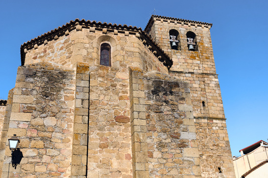 Plasencia Spain 03 December 2025 View of Iglesia del Salvador with its historic stone walls and bell tower under a clear blue sky. Plasencia Spain 03 December 2025 View of Iglesia del Salvador with its historic stone walls and bell tower under a clear blue sky.