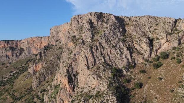 Aerial view of rugged limestone cliffs in Terrasini Italy.