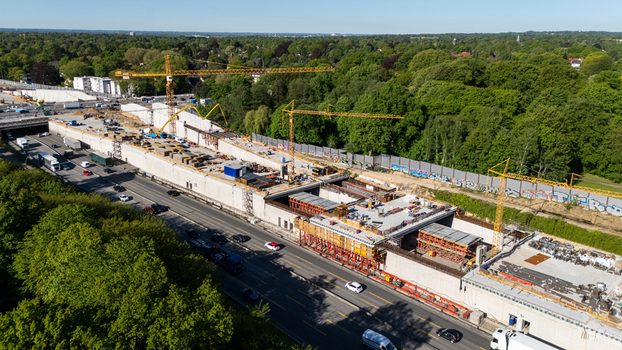 Aerial view of the Bahrenfeld motorway tunnel construction site with yellow cranes and concrete structures along the A7 highway in Hamburg Hamburg Germany.
