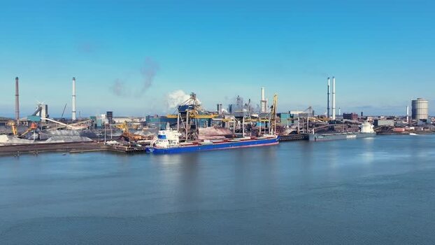 Aerial view of cargo ships and industrial port Netherlands.
