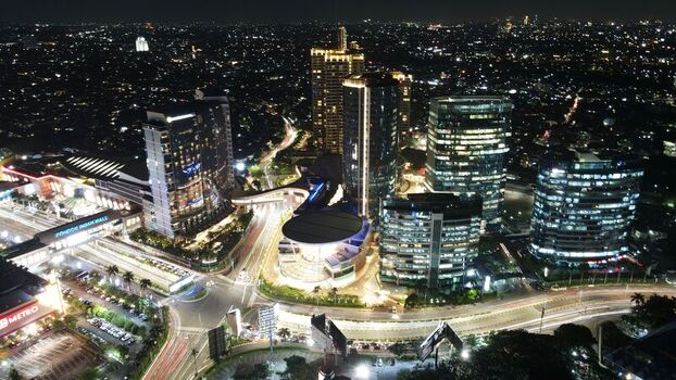 Kecamatan Kebayoran Lama Indonesia 22 September 2022 Aerial view of Pondok Indah Mall 2 illuminated at night with city lights and traffic trails in Daerah Khusus Ibukota. Kecamatan Kebayoran Lama Indonesia 22 September 2022 Aerial view of Pondok Indah Mall 2 illuminated at night with city lights and traffic trails in Daerah Khusus Ibukota.