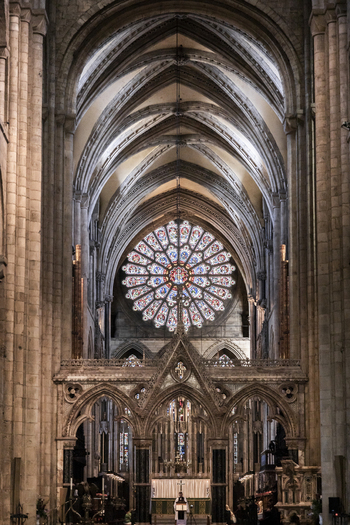 View of the interior of Durham Cathedral with its intricate rose window vaulted stone ceilings and ornate gothic architecture in Durham England United Kingdom. View of the interior of Durham Cathedral with its intricate rose window vaulted stone ceilings and ornate gothic architecture in Durham England United Kingdom.