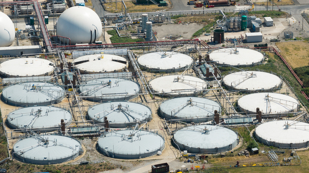 Aerial view of Severn Trent Water Minworth sewage treatment plant with circular sedimentation tanks and large white storage domes in Birmingham England United Kingdom. Aerial view of Severn Trent Water Minworth sewage treatment plant with circular sedimentation tanks and large white storage domes in Birmingham England United Kingdom.