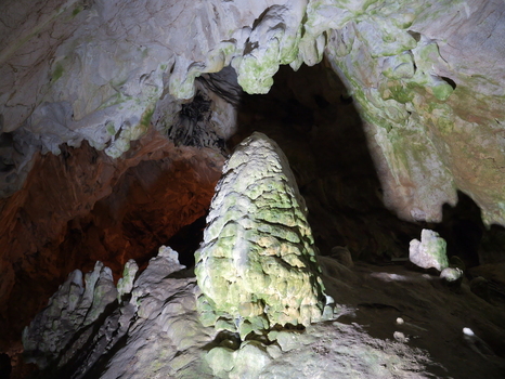 View of Vrelo Cave featuring a large textured stalagmite formation illuminated within the cavern showcasing limestone details in Matka Komuna e Sopishtes North Macedonia.