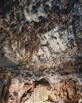 View of the Cango Caves showing intricate stalactite formations and textured limestone walls in Oudtshoorn Western Cape South Africa. View of the Cango Caves showing intricate stalactite formations and textured limestone walls in Oudtshoorn Western Cape South Africa.