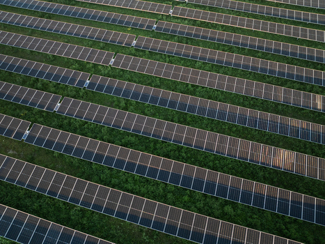 Aerial view of rows of solar panels installed in a green field under soft sunlight Augusta Sicily Italy. Aerial view of rows of solar panels installed in a green field under soft sunlight Augusta Sicily Italy.