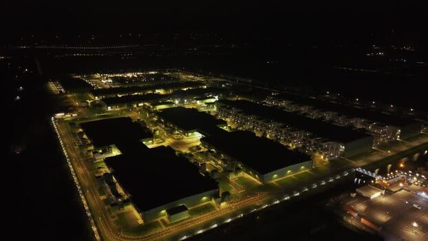 Aerial view of a data center at night in the Netherlands.