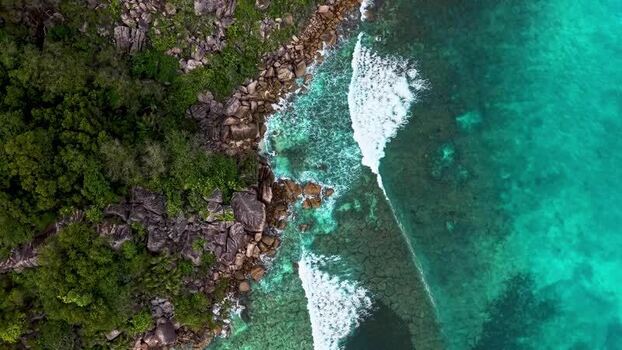 Aerial view of rocky coastline and turquoise water in Seychelles. Aerial view of rocky coastline and turquoise water in Seychelles.