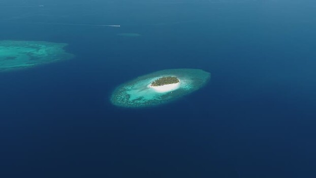 Aerial view of a tropical island and coral reef Maldives. Aerial view of a tropical island and coral reef Maldives.