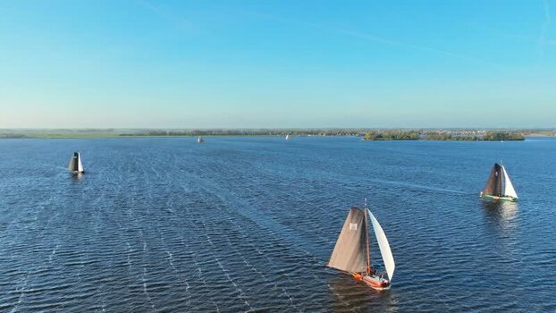 Aerial view of traditional sailboats on a lake Netherlands.