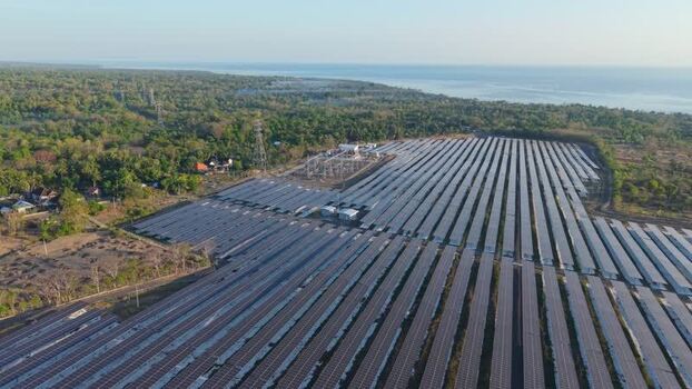 Aerial view of PLTS Bali Timur solar farm in Indonesia. Aerial view of PLTS Bali Timur solar farm in Indonesia.