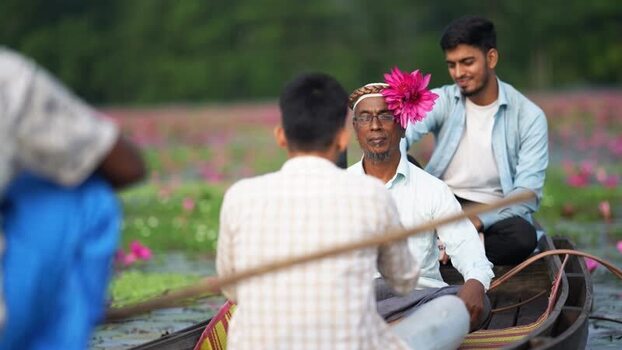 View of men in a boat on a lily pond Bangladesh. View of men in a boat on a lily pond Bangladesh.