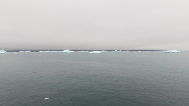 Aerial view of icebergs floating in the sea Greenland. Aerial view of icebergs floating in the sea Greenland.
