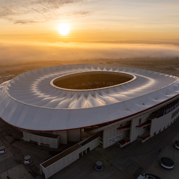 Aerial view of Riyadh Air Metropolitano Stadium surrounded by morning fog at sunrise in Madrid Comunidad de Madrid Spain.