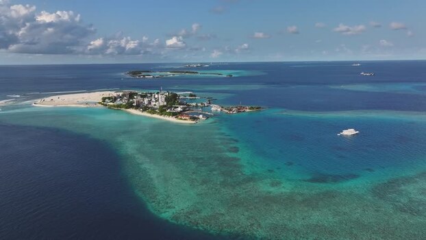 Aerial view of Gulhi island and coral reefs Maldives. Aerial view of Gulhi island and coral reefs Maldives.