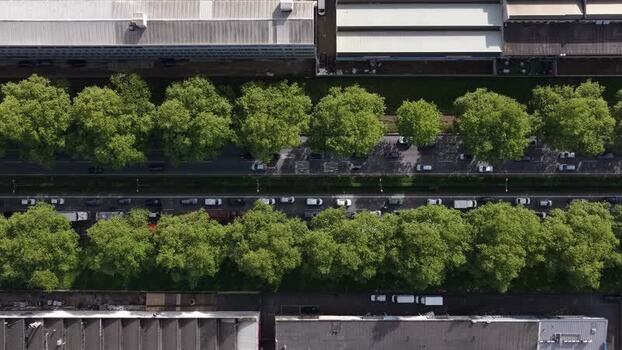Aerial view of warehouses and factories and a tree lined road Portugal.
