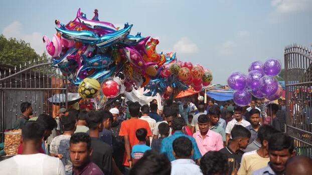View of a crowded market with colorful balloons in Bangladesh. View of a crowded market with colorful balloons in Bangladesh.