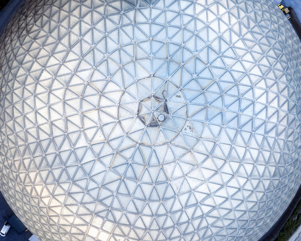 Aerial view of the Irish Cement Ltd geodesic dome featuring an intricate triangular metallic grid pattern in Drogheda County Louth Ireland. Aerial view of the Irish Cement Ltd geodesic dome featuring an intricate triangular metallic grid pattern in Drogheda County Louth Ireland.