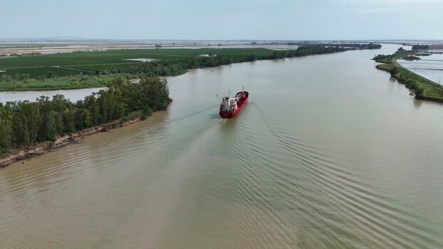 Aerial view of a cargo ship on the Guadalquivir river Spain. Aerial view of a cargo ship on the Guadalquivir river Spain.