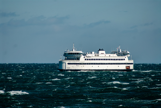 View of Martha s Vineyard ferry crossing choppy blue waters under a clear sky Edgartown Massachusetts United States.