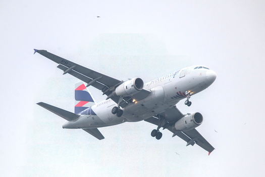 Rio de Janeiro Brazil 15 May 2026 View of a commercial airplane with landing gear down approaching Santos Dumont Airport against an overcast sky. Rio de Janeiro Brazil 15 May 2026 View of a commercial airplane with landing gear down approaching Santos Dumont Airport against an overcast sky.