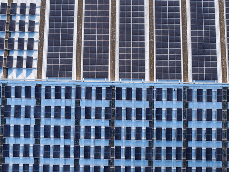Aerial view of solar panels installed on a large industrial factory roof in Kilsyth South Melbourne VIC Australia. Aerial view of solar panels installed on a large industrial factory roof in Kilsyth South Melbourne VIC Australia.